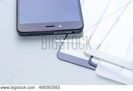 Maintenance And Repairing Smartphones. Many Tempered Glass Screen Protector