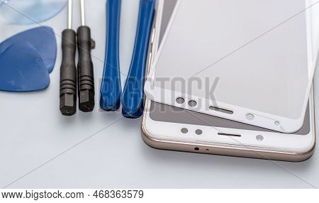 Maintenance And Repairing Smartphones. Many Tempered Glass Screen Protector