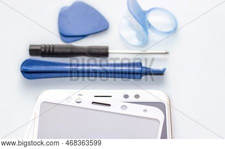 Maintenance And Repairing Smartphones. Many Tempered Glass Screen Protector And Mobile Phone, Replac