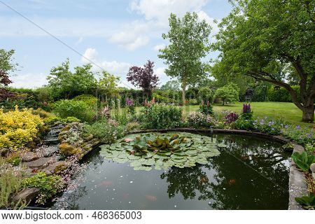 Cowlinge, Suffolk, England - May 29 2018: Stunning Landscaped Garden With Water Feature, Lily Pond, 