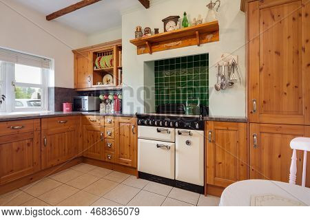 Cowlinge, Suffolk, England - May 29 2018: Attractive Traditional Farmhouse Kitchen With Pine Buildt 