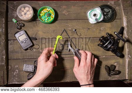 Fishing Tools In Hands. Fisherman Getting Ready For Fishing. Loop Weaving Tool.