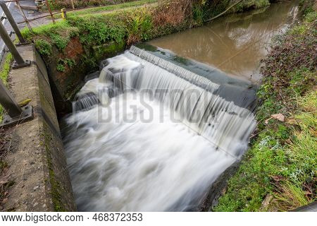 Long Exposure Of A Watefall On The River Lim Walkway At Lyme Regis In Dorset.