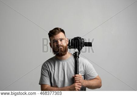 Professional Bearded Videographer, Cinematographer, Cameraman Using Camera On Gimbal Stabilizer, Ste