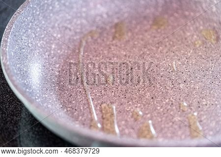 Frying Small Pancakes On A Kefir Base In A Frying Pan.