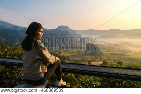Women Watching Sunrise With Fog At Phu Langka In Northern Thailand, Mountain View Of Phu Langka