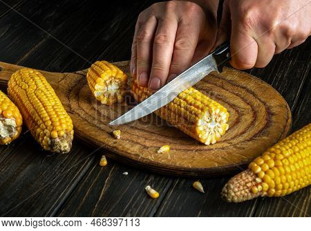 The Chef Cuts The Grains Of Corn With A Knife. Maize Is An Excellent Dietary Breakfast Or Lunch By T