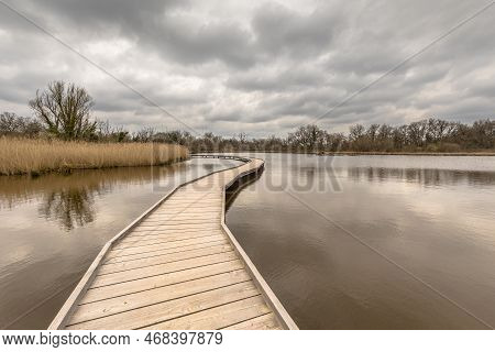 Wetland Boardwalk Over Lake In Early Spring In Natere Reserve La Brenne, France. Wheelchair Accessib