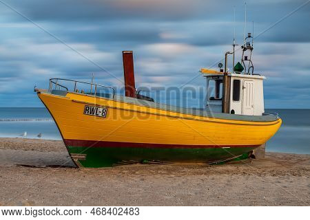 Rewal, Poland - Circa August 2021: Fishing Boat On The Beach In Rewal Circa August 2021 In Rewal.