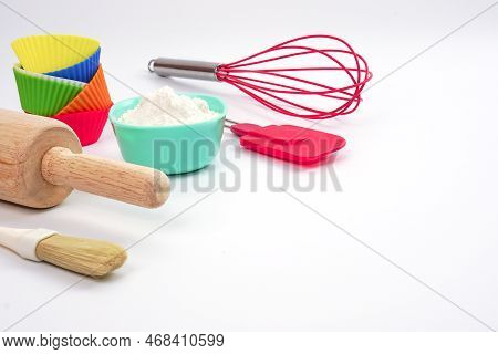 Top View Set Of Kitchen Utensils And Ingredients For Bakery On White Background. Materials Or Kitche