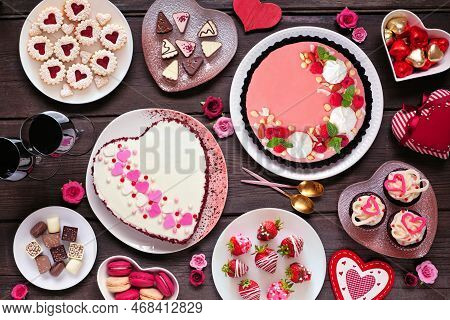 Valentines Day Table Scene With A Selection Of Desserts And Sweets. Top Down View On A Dark Wood Bac