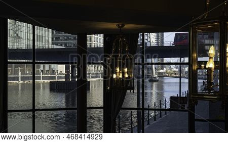 London - 01 26 2022: Interior of the Britannia International Hotel at 163 Marsh Wall, overlooking the docks with lanterns in the foreground