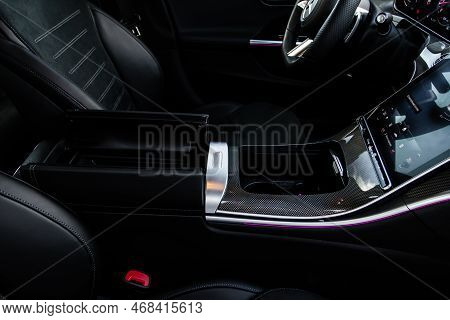 Car Armrest Opened. Opened Armrest In The Car For Driver.