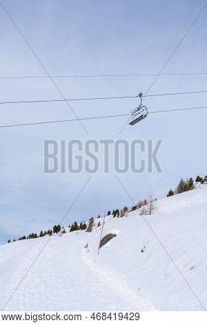 Focus On Red Chairlift In Winter In Ski Resort St. Luc In Wallis Switzerland.