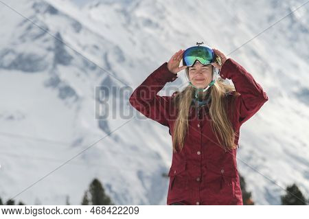 Kaltenbach ​hochfugen, Austria - 01 Jan, 2023: Happy Girl In A Ski Mask And Helmet At A Ski Resort I