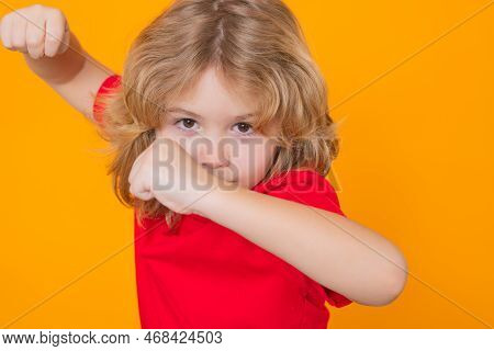 Child With Fist Gesture Fight. Andry Child Boy In Red T-shirt Making Stop Gesture On Isolated Studio