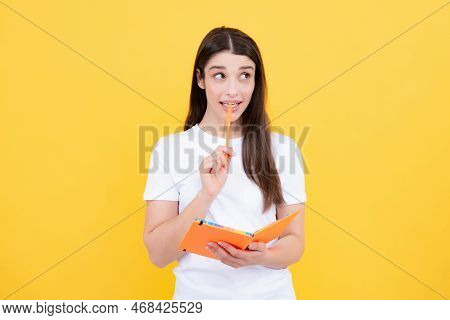 Thinking Student. Portrait Of Student Woman. College Or High School Ducation. Serious Young Woman Wi