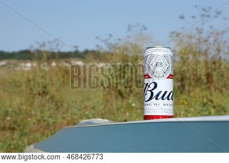 Sumy, Ukraine - August 01, 2021: Can Of Budweiser Lager Alcohol Beer On Overturned Kayak Boat Outdoo