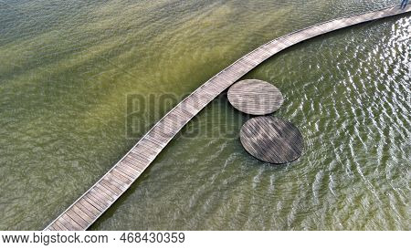 Floating Walkway Made Of Wooden Planks. Narrow Curved Paths On Stilts Driven Into The Bottom, Above 