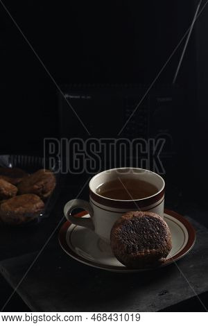 Apang Bale Cake Or Apang Bakar, And A Cup Of Tea Isolated On Black Background. Indonesian Cake