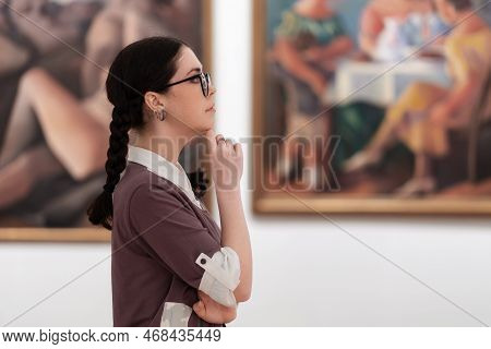 Cultural Education And Excursion. Side View Of Caucasian Pretty Young Woman Wearing Glasses Contempl
