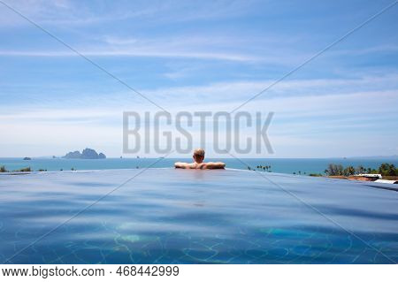 Male Resting In Infinity Pool At Aonang Cliff Beach Resort