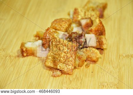 Slice Crispy Pork On Wooden Chop Block