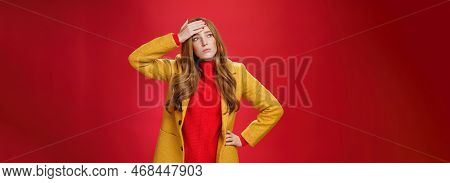 Girl Having Feaver Touching Forehead With Palm Looking Displeased And Bothered Left As Thinking She 