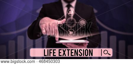 Hand Writing Sign Life Extension. Word Written On Able To Continue Working For Longer Than Others Of