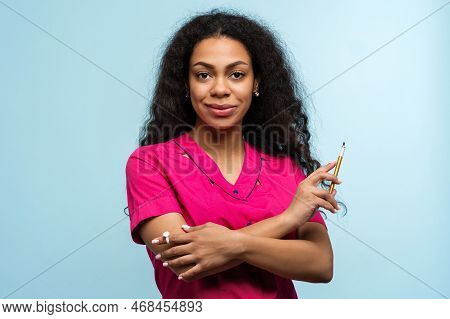 Portrait Non-caucasian Skinned Woman Master Beautician Of Eyebrow Tattooing On Blue Background. Eyeb