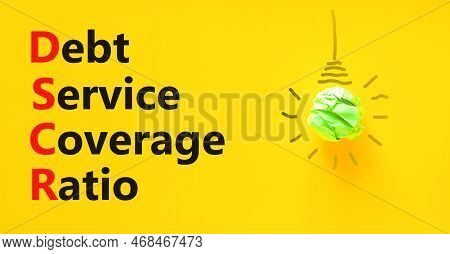 Dscr Debt Service Coverage Ratio Symbol. Concept Words Dscr Debt Service Coverage Ratio On Yellow Pa