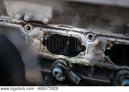 Close Up Of Dirty Intake Manifold Ports. Car Repair Concept. Dirty Intake Manifold. Dirty Engine Int