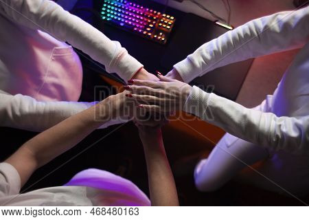 Computer Team Discussing Strategy Together And Holding Hands, Team Set Up Before Game In Computer Cl