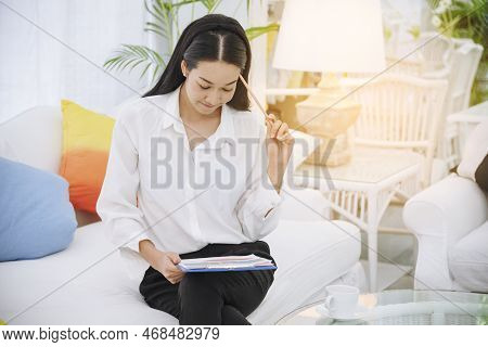 Happy Asian Woman Reading Book Outdoor In Green Park Nature. Reading Book Magazine Relaxation Woman.