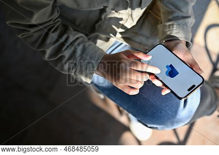 Chiang Mai, Thailand - Dec 27 2022: A Female Using Paypal Application On Her Smartphone, Transferrin