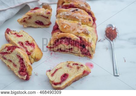 Sweet Home Made Saffron Babka Brioche With Raspberries On A Table