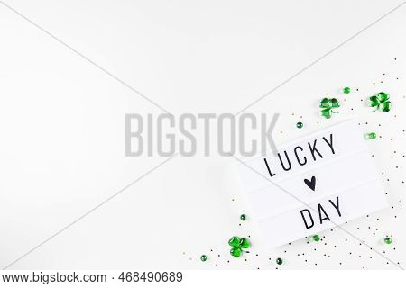 Lightbox With Saint Patricks Day Greeting And Shamrocks Of Green Glass Hearts
