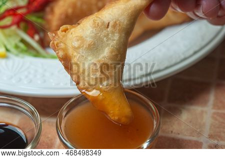 Closeup A Plate Of Fried Dumplings. Delicious Japanese Pan-fried Dumplings Calls Gyoza Or Known As C