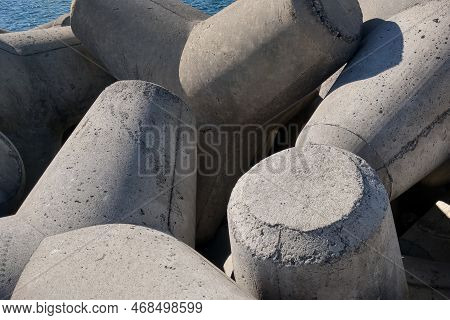 Close-up On The Concrete Structure Tetrapods. Concrete For Hydraulic Structures. Concrete Breakwater