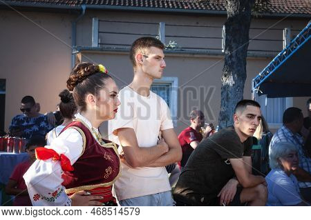 Pecinci, Serbia - June 19, 2022: Young Woman Wearing A Traditional Serbian Costume Getting Prepared 