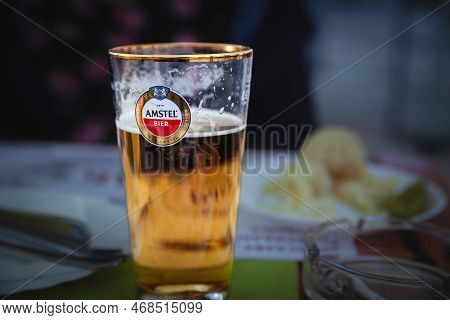 Belgrade, Serbia - May 7, 2022: Selective Blur On A  Logo Of Amstel Beer On A Glasssponsored By The 