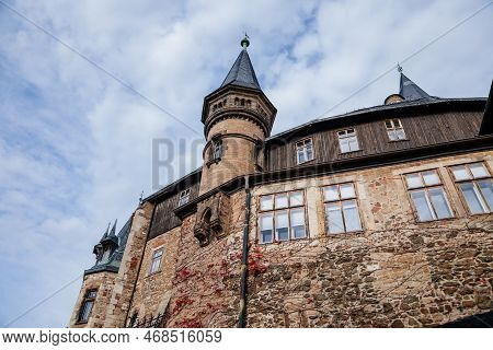 Wernigerode, Saxony-anhalt, Germany, 29 October 2022:  Castle With Tower In Harz Mountains Above Tow