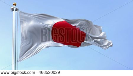 Japan National Flag Waving In The Wind On A Clear Day. Red Disc On A White Field. Japan Is An Island