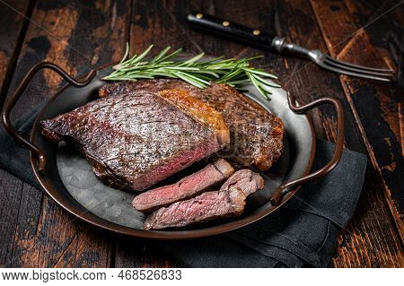 Grilled Picanha Or Top Sirloin Beef Steak With Rosemary In Steel Tray. Wooden Background. Top View.