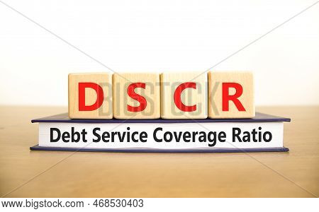 Dscr Debt Service Coverage Ratio Symbol. Concept Words Dscr Debt Service Coverage Ratio On Wooden Bl
