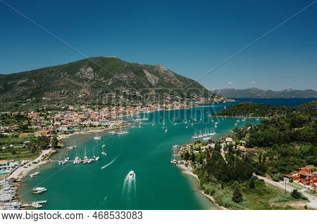Popular Tourist Destination. Bay With Boats On Lefkada Island. Nydri Village.