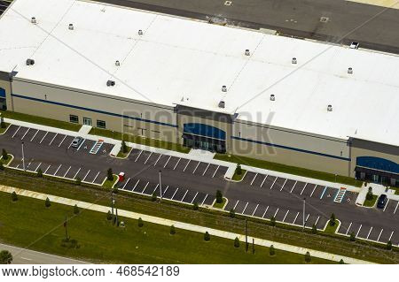 Aerial View Of Industrial Park With Goods Warehouses And Logistics Centers In City Zone From Above.