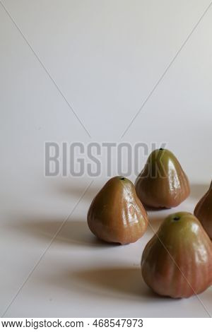Freshly Rose Apple Or Chomphu Fruit On White Background. The Fruits Are Sweet And Red Or Green.