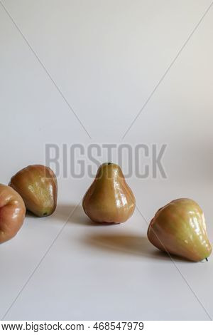 Freshly Rose Apple Or Chomphu Fruit On White Background. The Fruits Are Sweet And Red Or Green.