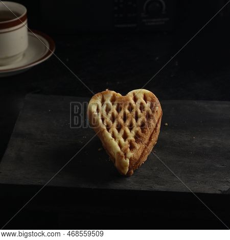 Wapili Or Wafili Cake And Tea Isolated On Black Background. Indonesian Cake